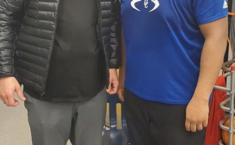 SUBMITTED PHOTO Kennesaw State inside linebackers coach Greg Harris recently visited with OCHS football player KB Bonds and other athletes.