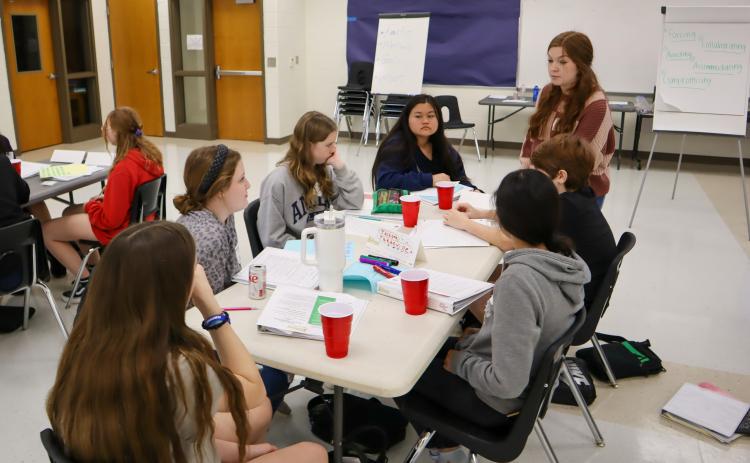 Youth Leadership Oglethorpe facilitator Ally Kelley-Morris, a junior at Oglethorpe County High School, discusses types of conflict with OCMS students in a class last week. (Photo/Viktoria Kangas)