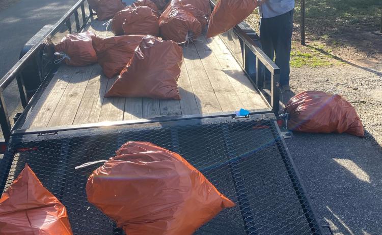 Twice each month, first-time DUI offenders are court-ordered to provide community service by picking up litter along Oglethorpe County’s streets and roads. On Jan. 28, six offenders gathered 180 pounds of debris along a half-mile stretch of Woodlawn Street in Crawford. Loading the orange bags is Will Eberhart, who supervises the detail for the Oglethorpe County Public Works Department. TAYLER EBERHART/FOR THE OGLETHORPE ECHO