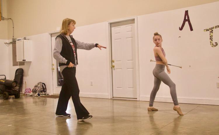 Polly Fleming, who said she has almost “an unhealthy love for twirling,” coaches Kassie Mathews at her studio in Crawford. Fleming has coached twirling since her freshman year at Abraham Baldwin Agricultural College. (Photo/Olivia Shapiro)