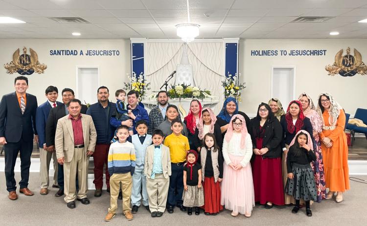 Members of The Light of The World Church congregate in their temple in Lexington earlier this year. The temple opened more than two years ago to provide a home to church members in this area. (Photo/Maddie Daniel)