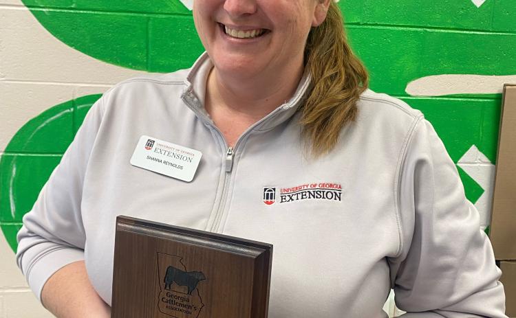 Shanna Reynolds holds the award for the 2022 "County Extension Agent of the Year" she received at the Georgia Cattlemen's Association conference in Columbus, Georgia on March 9, 2023. (Dink Nesmith/ The Oglethorpe Echo)