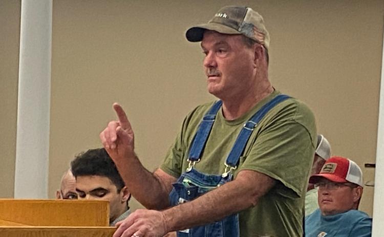 (DINK NESMITH/THE OGLETHORPE ECHO) Brian Angel speaks against a rezoning request to build new poultry houses on Bethesda Church Road. The Board of Commissioners unanimously denied the request in Monday’s meeting.
