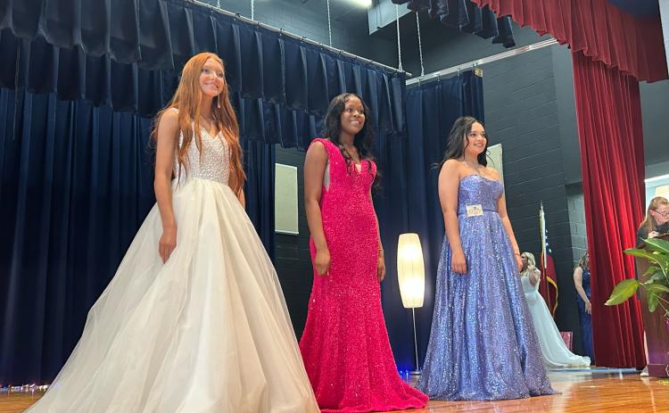 Mylee Simmons (from left), Macayla Hull and Malia McCalla compete in the Miss Oglethorpe pageant on Saturday. (Shelby Wingate/ The Oglethorpe Echo)