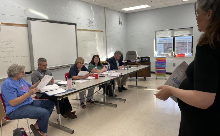(Alex Bavosa/The Oglethorpe Echo) Jennifer Yauck (right), an Oglethorpe County High School teacher, updates the Board of Education on the status of the Dolly Parton Imagination Library, a program that provides children with free books.