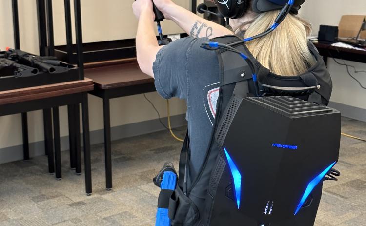 Courtney Corbin, who works with the Oglethorpe County Sheriff’s Office, trains with a virtual reality simulator, which the department received last month. The simulator helps deputies prepare for a variety of scenarios. (Submitted Photo/The Oglethorpe Echo)
