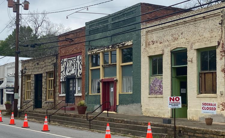(Dink Nesmith/The Oglethorpe Echo) A stretch of sidewalk and parking along West Main Street in Lexington has been closed because the adjacent buildings have been determined to be unsafe.