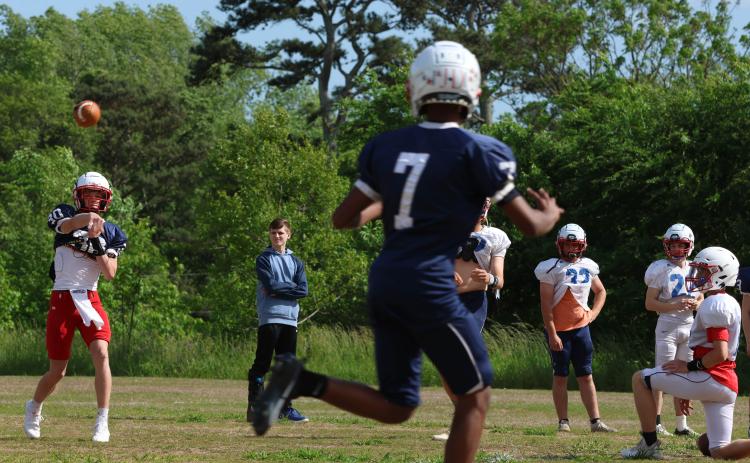 Oglethorpe County’s Hunter Hall (30) throws to Nicah Pass (7) at spring practice last week. The Patriots began drills on May 9 and will continue through the spring game at Chestatee at 7 p.m. Thursday, May 18. (LANDEN TODD/THE OGLETHORPE ECHO)