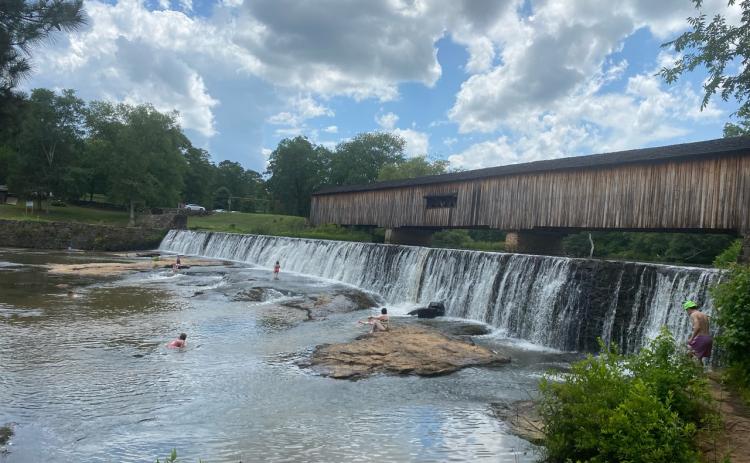 Watson Mill State Park is one of Oglethorpe County’s signature historic landmarks. If you talked to the people splashing in the water below the bridge, they’d probably say, “This is what you call summertime ‘quality of life.’ ” (DINK NESMITH/THE OGLETHORPE ECHO)