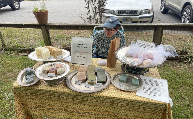Emily Thomas recently began soap making as a hobby and set up a table at the second annual Art Bazaar and Book Sale, which was held on Saturday at No. 3 Railroad Street in Arnoldsville. "Peggy (Hroma) convinced me to come out here and sell my soap and it has been really successful so far." (RAMON ELORTONDO/THE OGLETHORPE ECHO)