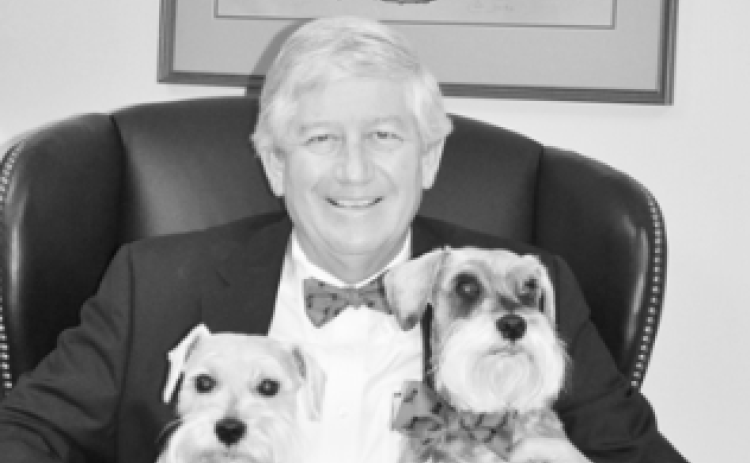 My Augusta friends, Abram and Cookie Serotta, sent me three red and black bow ties. The UGA grads loved Amos and Andy, too. This photo was taken in my office. Above my head is a Jack Davis print that Bulldog great Lindsay Scott autographed, along with his 1980 national championship teammates.