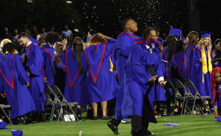 Members of the OCHS senior class rejoice on the football field after graduating on Friday at Patriot Stadium. (LANDEN TODD/THE OGLETHORPE ECHO)