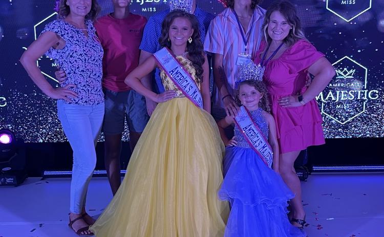 Pageants are a family affair for the Raines family. The support for Madalyn (front left)), who is 11 years old, and Isabella (front right), who is 5, includes (from left) Brandy, Grayson and Chris (Madalyn’s mom, brother and dad), and Ian and Megan (Isabella’s mom and dad). (SUBMITTED PHOTO)
