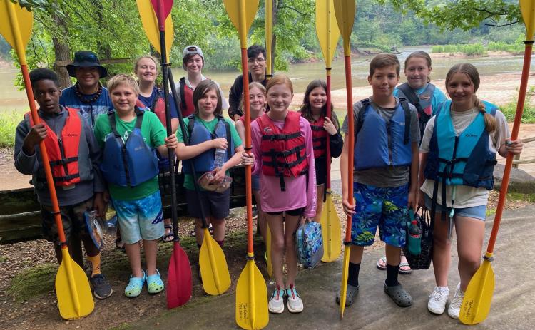 Taylor McGreavy (from left), Justin Loggins, J.T. Mathews, Audrey Green, Devyn Patrick, Jayden McGreavy, Jaxson Blocker, Rebecca Jones, Mae Mathews, McKinley Grimes, Eli Patton, Haleigh Baker and Kiley Paul took part in a kayaking trip. (SUBMITTED PHOTO)