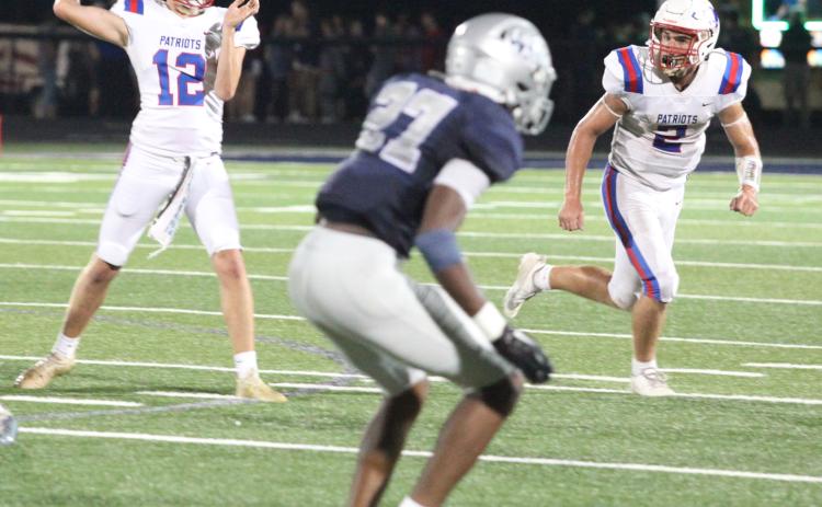 Quarterback Jayden Wallace delivers the ball to a teammate in Oglethorpe County’s season-opening 14-7 loss to East Jackson on Friday. He threw a 55-yard touchdown pass to Darius Heard in his first start at quarterback. (DONNY FAUST/FOR THE OGLETHORPE ECHO)