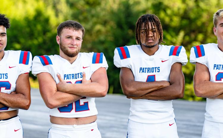 Seniors Quintin Nash (from left), Caleb Hall, Elijah Hood and Jake Turner show off Oglethorpe County’s new Nike uniforms during the team’s photo day on July 31. The program made the switch from Adidas to Nike this summer. (JACK CASEY/THE OGLETHORPE ECHO)