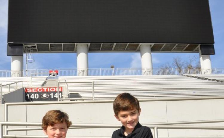 Thanks to the ingenuity of the great-grandfathers of Lamartine Griffin (Lam) Hardman V, left, and Henri Leon (Beau) Farmer IV, the Georgia Bulldogs have played between the hedges in Sanford Stadium since 1929. Today, Lam Hardman, left, is a senior at Athens Academy, thinking about UGA. Beau, right, is a junior, studying accounting, at Georgia College and State University in Milledgeville. (SUBMITTED PHOTO)