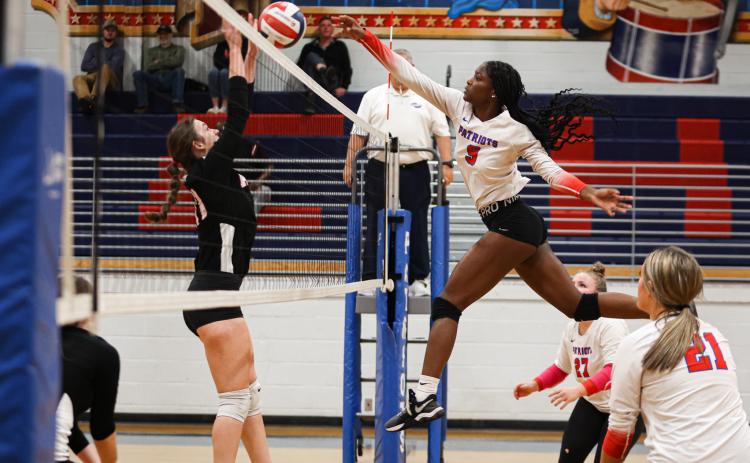 Junior Kenzie Henderson spikes the ball during Oglethorpe County's first-round Class A Division I tournament win over Rabun County on Oct. 18. The Patriots advanced to the Sweet 16, but fell to Whitefield Academy on Saturday. (CASSIDY HETTESHEIMER/THE OGLETHORPE ECHO)