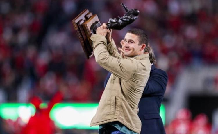 There was plenty to cheer about in Sanford Stadium on Saturday. One of the loudest roars was for No. 19 Brock Bowers, the All-America tight end, who returned from the injured list to score a touchdown. Another was for Stetson Bennett IV, above. The former Heisman Trophy finalist stepped onto the field to hoist the 2022 Burlsworth Trophy, which is awarded to the best college football player whose career began as a walk-on. (Tony Walsh/UGA Athletics)