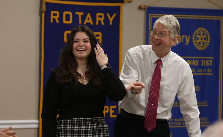 Oglethorpe County High School’s 2024 STAR student Macie McDaniel (left) and STAR teacher Eric Schmidt (right) share a laugh during the Oglethorpe Rotary Club meeting at the Farm Bureau on Feb. 2. McDaniel, a senior, and Eric Schmidt, who retired last year, were recognized during the meeting.