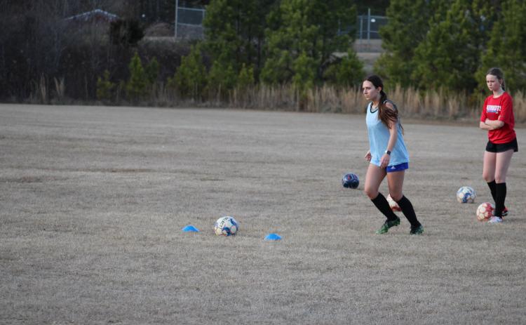 Emily Forschler lines up for a penalty kick during Oglethorpe Counties girls soccer team's practice on Thursday, Feb. 1. Forschler, alongside her sister Madeline, will be coached by their father for the first time of their high school careers. (Photo/Owen Warden)