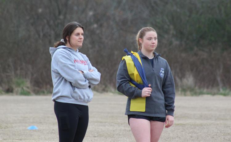 Alex Orlowsky and Taylor Doherty, former OCHS soccer players, now serve as volunteer assistants for coach Erich Forschler. (Samuel Higgs/The Oglethorpe Echo)