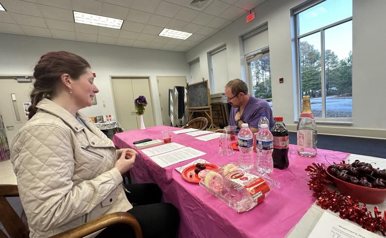 Katherine Ratcliffe answers questions from David Robinson, an attendee of the online dating event last Friday. Robinson lives in Comer and often visits the Oglethorpe County Library. (Photo/Izzy Wagner)