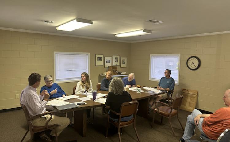 Lexington’s City Council and city officials discuss agenda items at its monthly meeting on March 14. Those pictured include city attorney Charlie Barrow (from left), Jill Severn, Jennifer Whitlock, Cory Crayton, Ronnie Boggs, Mayor Craig Snow and city clerk Kim Bradford. (Photo/Tyler Lary)