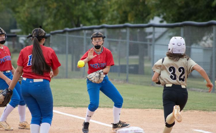 Freshman Jayden Ford catches the ball to ensure an out in Oglethorpe County’s game against Commerce softball game on Sept. 17. The Patriots have 12 wins this year, after finishing 2-20-1 in 2023. (Audrey Pfitzner/The Oglethorpe Echo)