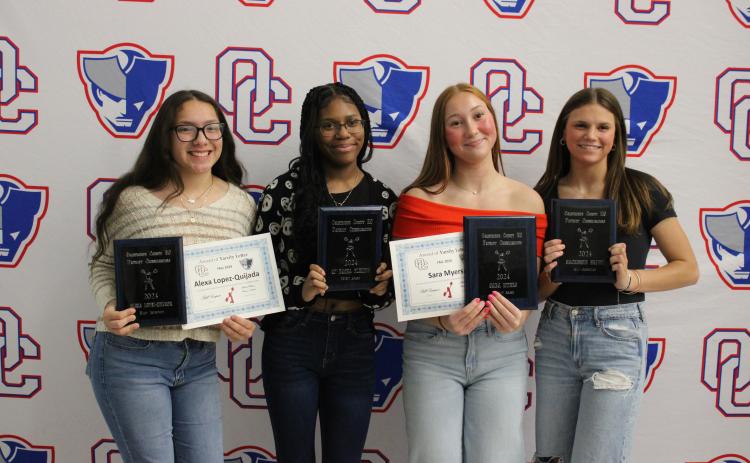 The cheer team award winners (from left): Alexa Lopez-Quijada (Most Improved), Qi’ Dasha Fleming (Spirit Award), Sara Myers (Patriot Award) and Mackensie Brown (All-American). (Audrey Pfitzner/The Oglethorpe Echo)