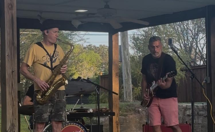 Saxophonist Bill Oglesby and guitarist Marcelo Buril open their set at Meson Park. The Original Screw Tops recently played at Number 3 Railroad St. in Arnoldsville. (Jet Rawls/ The Oglethorpe Echo)