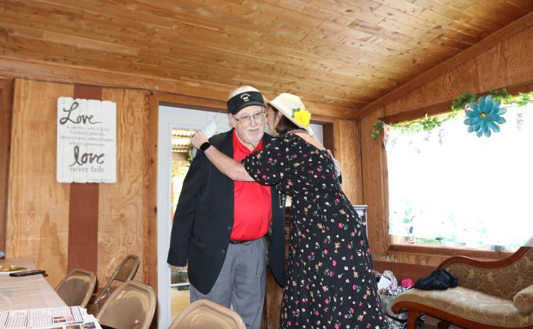 OCREA President Leslie Jones hugs Bill Sloan, who is with the Georgia Retired Educators Association, at OCREA’s 50th anniversary celebration at Countryside Catering. OCREA held its first meeting in 1975. Paige Clarke/The Oglethorpe Echo