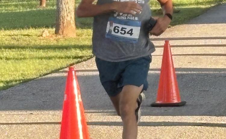 ANDY JOHNSTON/THE OGLETHORPE ECHO Cory Tillman, who runs for the Oglethorpe County cross country team, was the top finisher in the Restoration Run 5K on Monday. His teammates also ran in the 21st annual race.