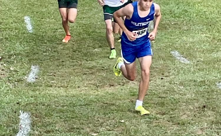 John Adams runs on his way to setting a personal best time of 17:38.86 for the Oglethorpe County cross country team in a meet at Athens Academy on Saturday. He finished 12th among individuals. (Photo Submitted)