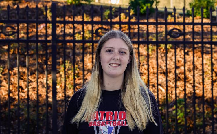 Oglethorpe County senior Ansley Paul stands outside the Turner Soccer Complex, where she shadows soccer associate athletic trainer Kelly Cich. Paul is the first student from Oglethorpe County to be selected for UGA’s Young Dawgs program (Drew Bearden/Oglethorpe Echo)