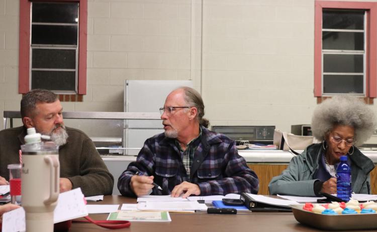 Mayor Edward Toledano (center) and city councilman Danny Gorman have a chat during a recent meeting at the Salem Volunteer Fire Department. City officials are looking into improving the water system. (Ansley Gavlak/The Oglethorpe Echo)