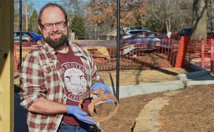 Jonathan Scott, Winterville’s cultural heritage director, holds a metal artifact earlier this month. The city plans a nearly year-long celebration of the country’s 250th anniversary. (Neva Drane/The Oglethorpe Echo)