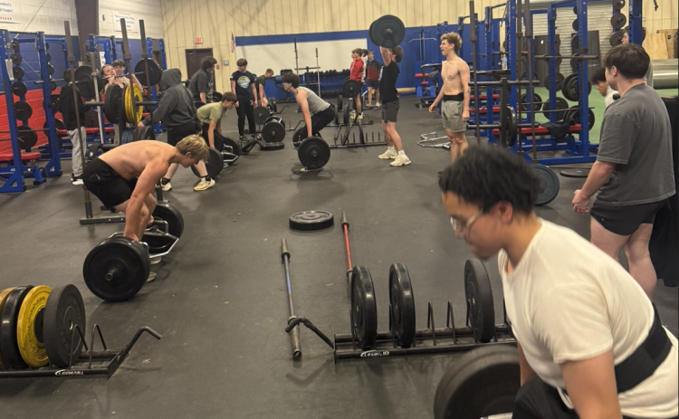 Students lift weights under the support and supervision of former teacher Steve Mason. Mason recently took a job at Commerce High School. (Submitted Photo)